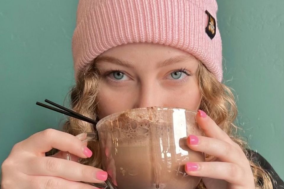 Sorority girl sipping chocolate drink